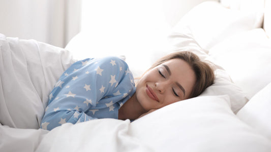 Young woman sleeping on a comfortable latex mattress and latex pillow.