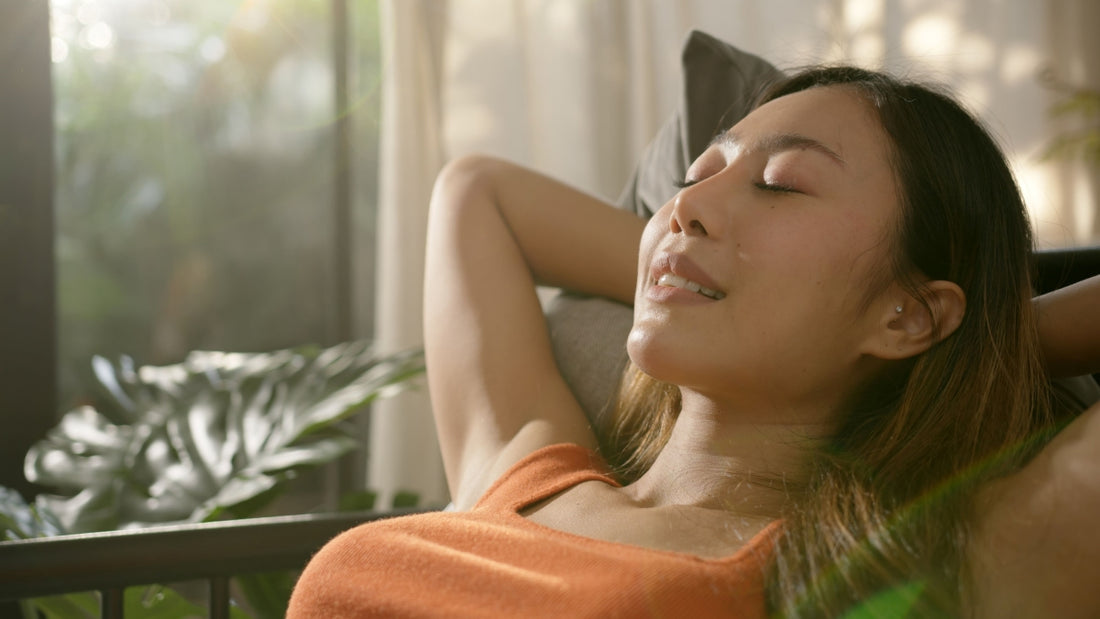 Woman relax on her mattress with very green scenery surrounding her