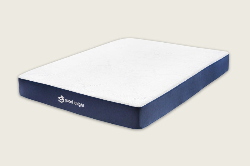 The Good Knight Athena Mattress made from all-natural latex displayed from an angle and showing its trademark Good Knight logo across the blue border of the mattress. 