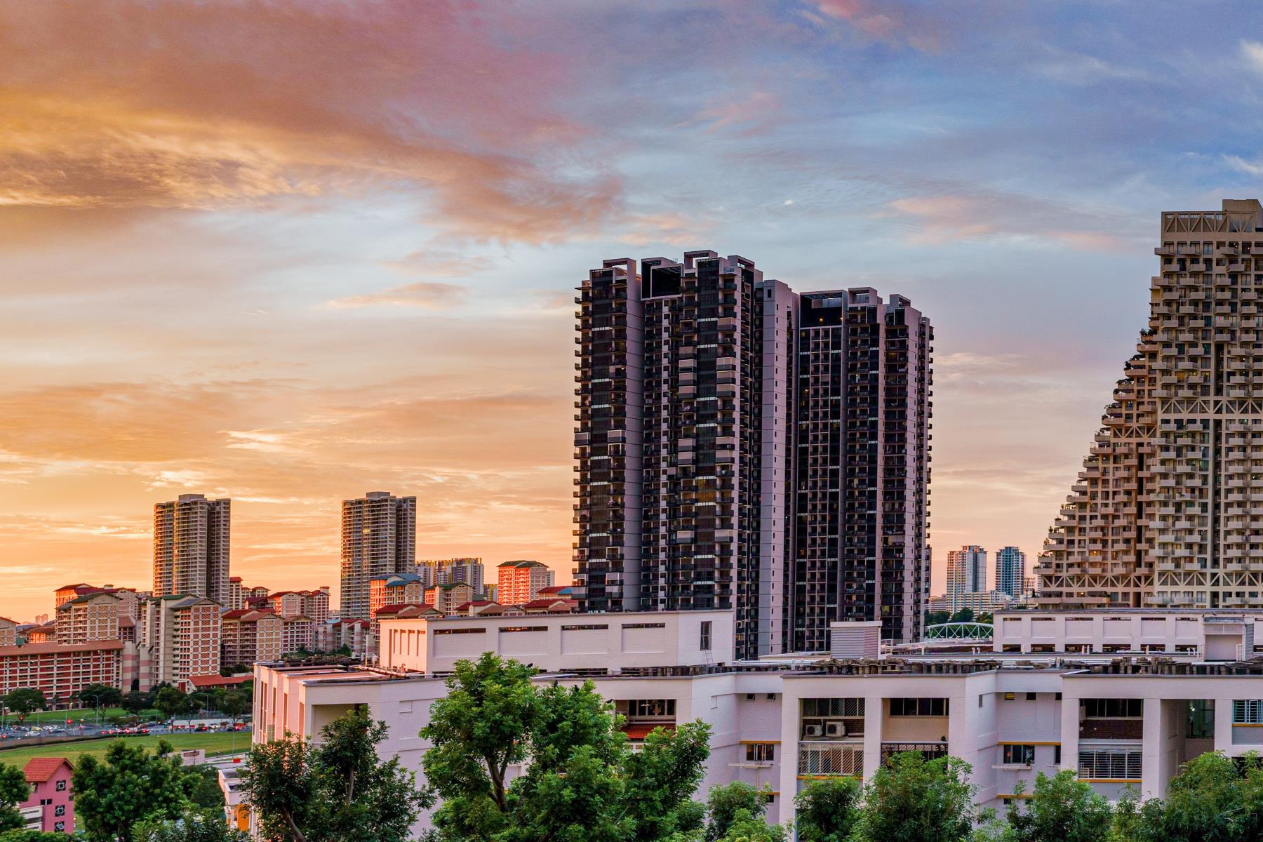 Panorama view of the Golden Hour sunset over the community parks and residential buildings in Bishan, Singapore